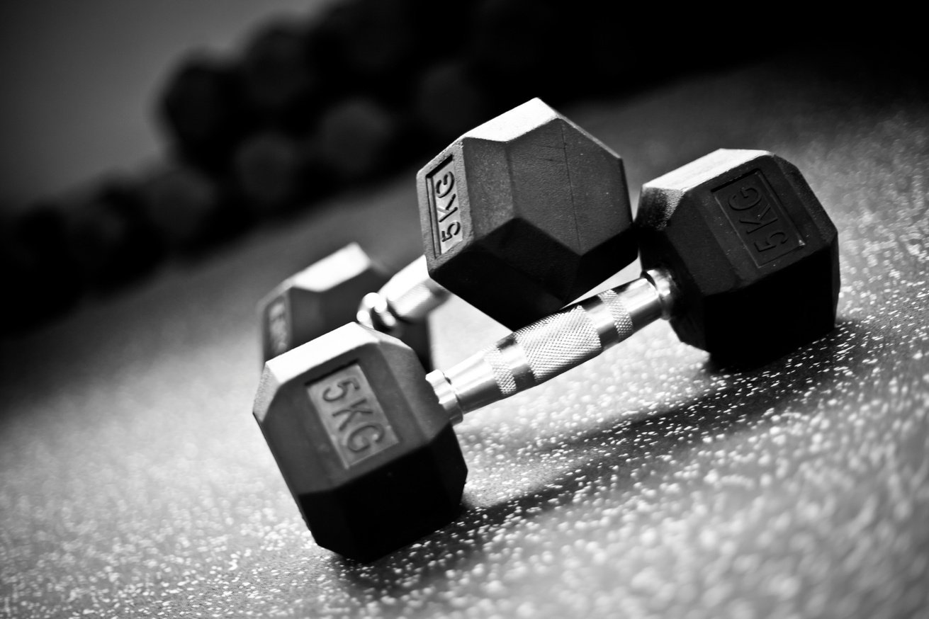 Weight lifting-Dumbells in a gym gym